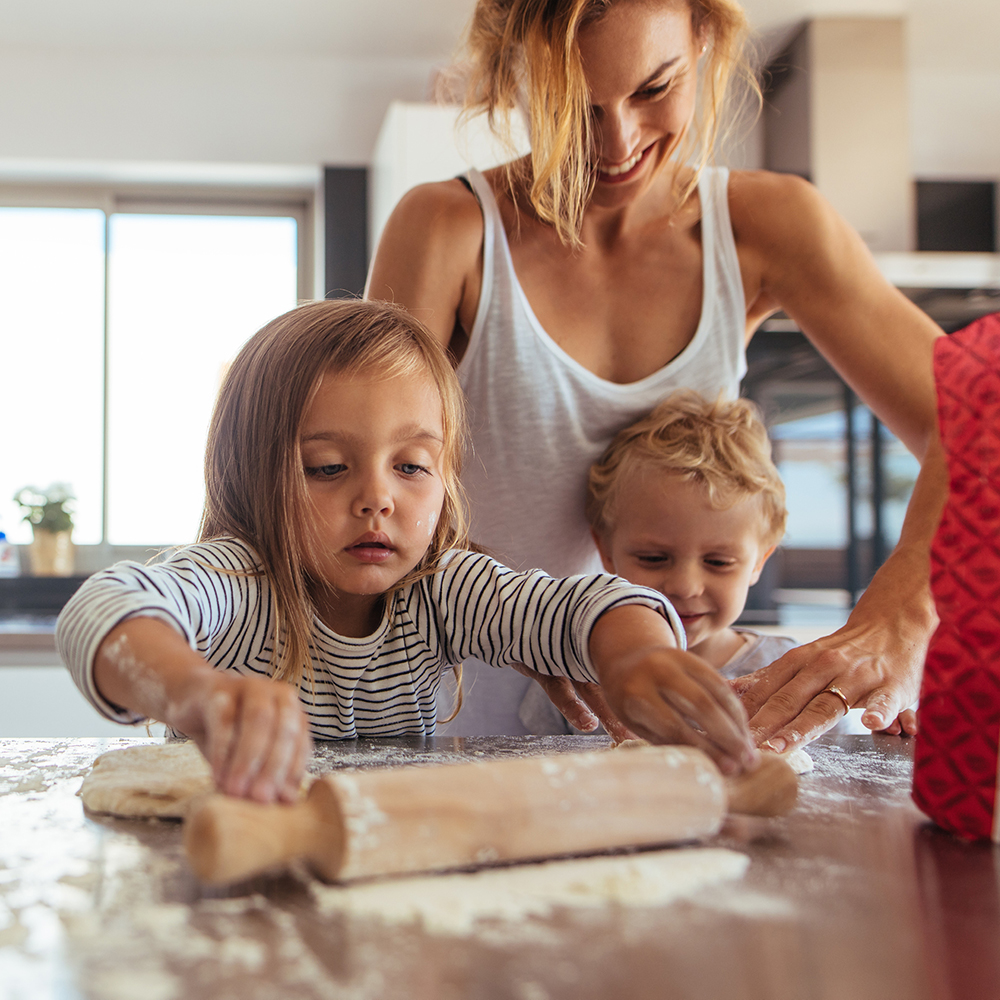 Mom and children baking