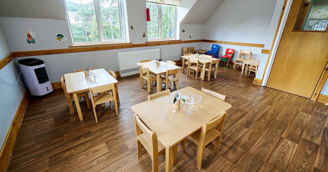 Nursery Room at Busy Bees Harrogate Cornwall Road with dining tables set up for lunch