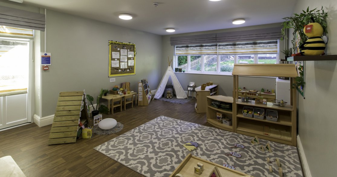 Nursery room at Busy Bees Guildford Fitzsimmons showing activities for all the children and teepee